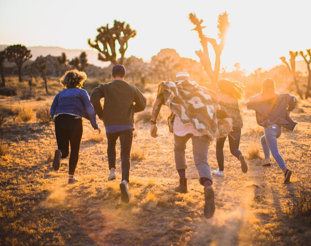 Youth running through a desert scene