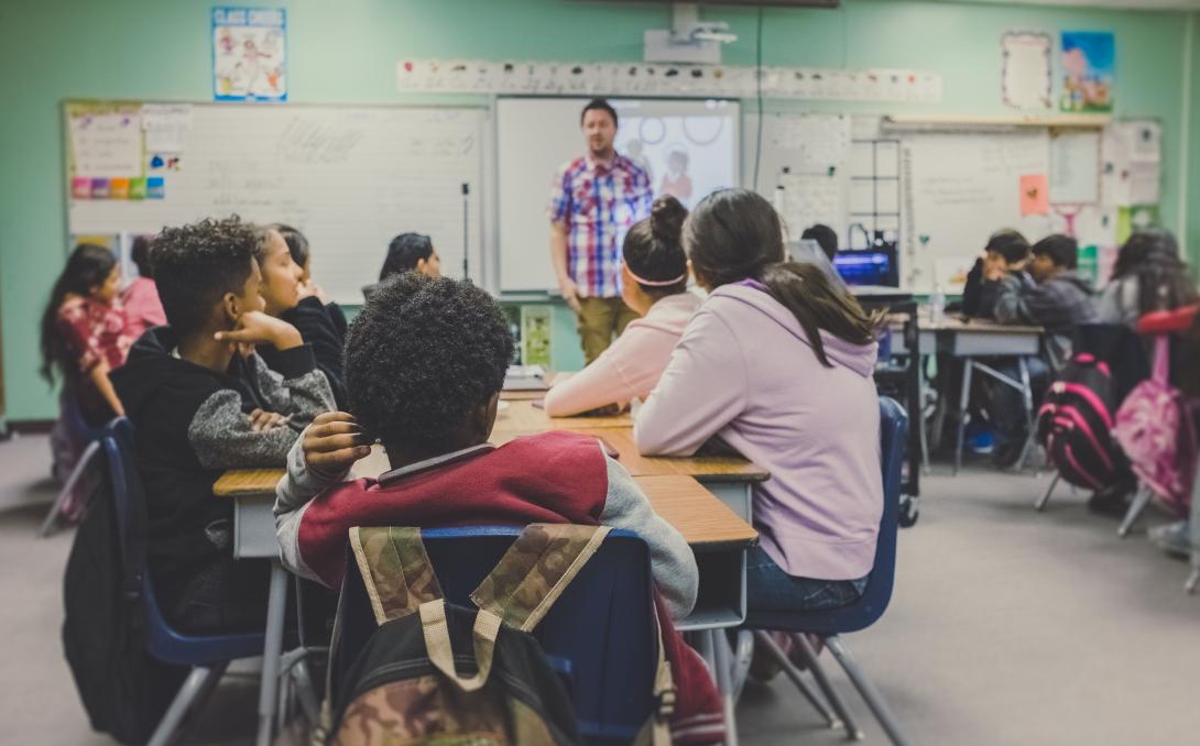 Students at a table in a classroom